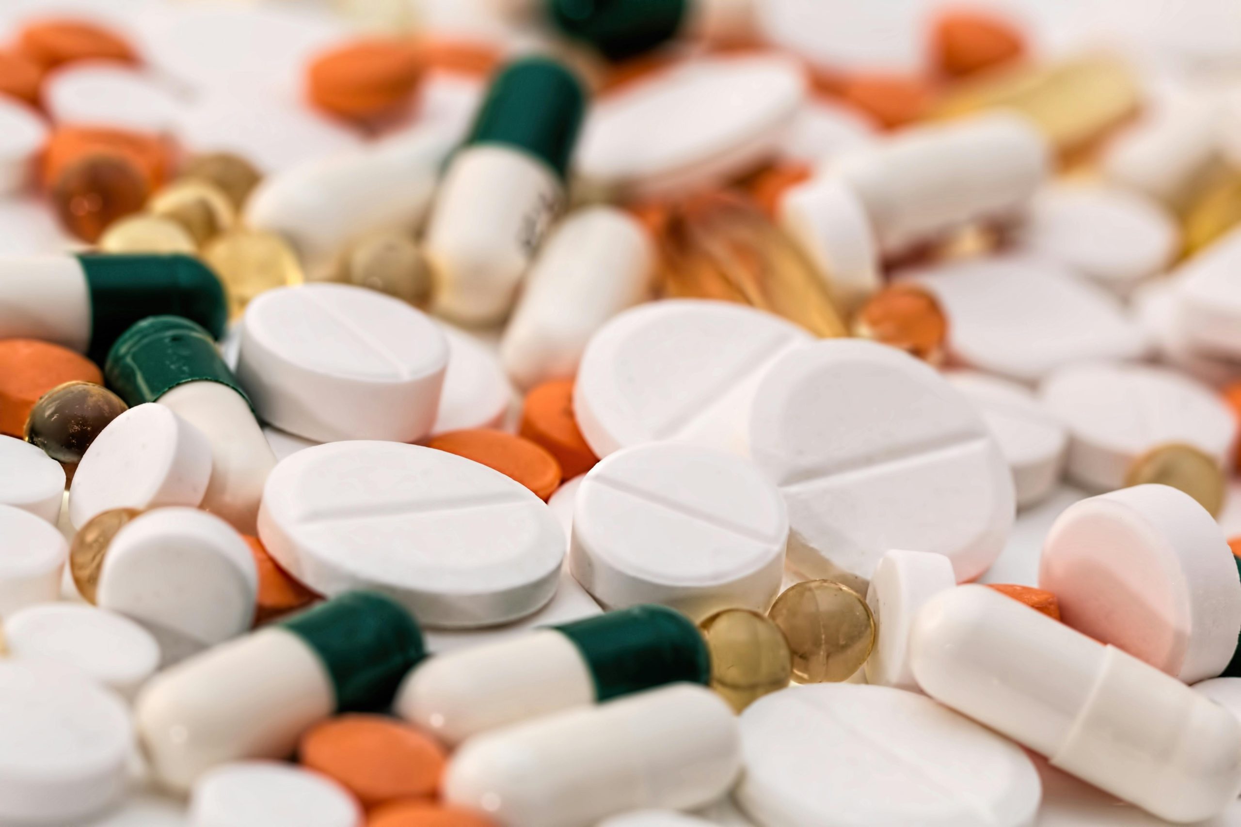A pile of different types of pills and antibiotics